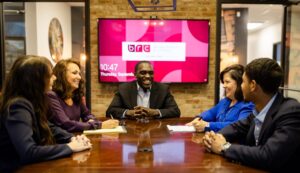 Professional Services Team sitting at conference table