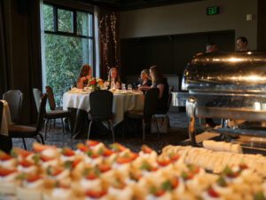 Restaurant dining scene with people seated at table eating.