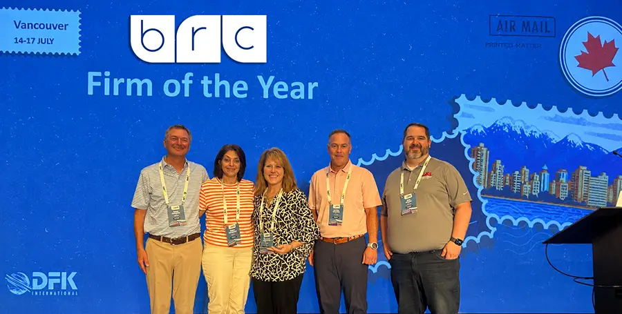 DFK International Firm of the Year - Group Photo Accepting Award